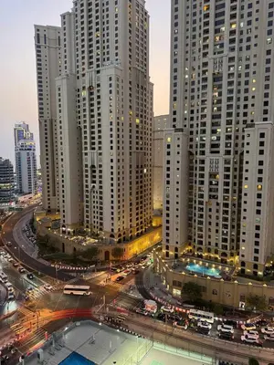 a city with many tall buildings and traffic at LYO guest house Dubai marina BEDSPACE in Dubai