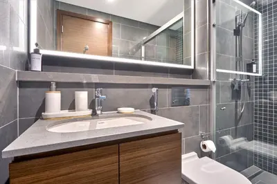 a bathroom with a sink and a mirror at STAY BY LATINEM Luxury 1BR Plus Study Holiday Home CB 1013 Near Burj Khalifa in Dubai