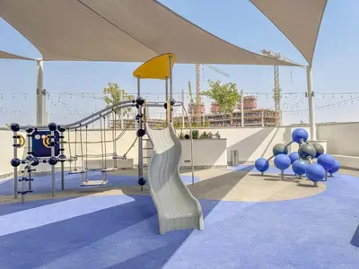 a childrens playground with a slide at Modern 1BHK Bunk Beds and Sofa Bed By Czechin in Dubai
