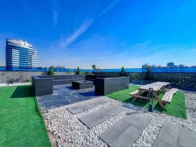 a park with a picnic table and a bench at GuestReady - Stylish l High Floor Studio in Dubai