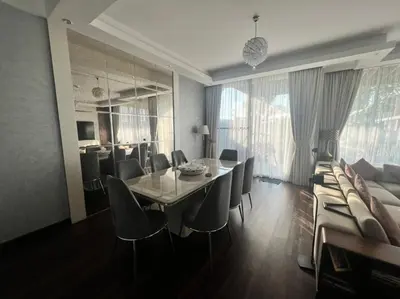 a dining room with a table and chairs at Private room in a luxury villa at Dubai hills in Dubai
