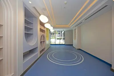 a hallway with a blue floor and a ceiling at Spacious Luxury Escape - Modern Comfort in Riviera in Dubai