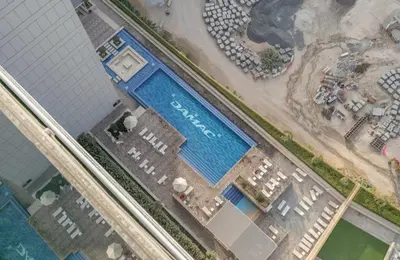 an overhead view of a swimming pool at a resort at High floor, Canal View, Parking, Crib, Dubai Mall & Burj Khalifa in Dubai