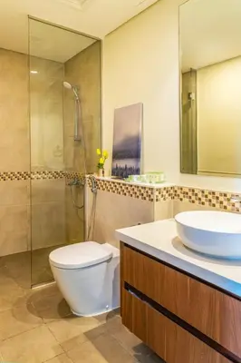 a bathroom with a toilet and a sink and a shower at High floor, Canal View, Parking, Crib, Dubai Mall & Burj Khalifa in Dubai