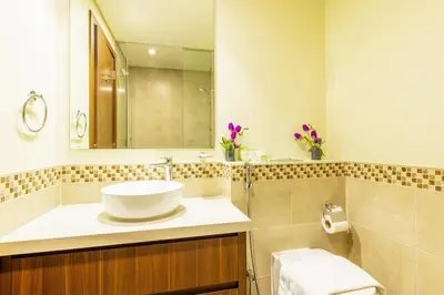 a bathroom with a sink and a mirror at High floor, Canal View, Parking, Crib, Dubai Mall & Burj Khalifa in Dubai