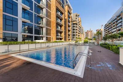a swimming pool in the middle of a building at 1 Bedroom Royal Dubai Stay in Dubai