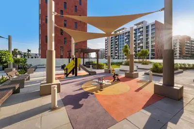 a rendering of a courtyard in a city with buildings at 1 Bedroom Royal Dubai Stay in Dubai