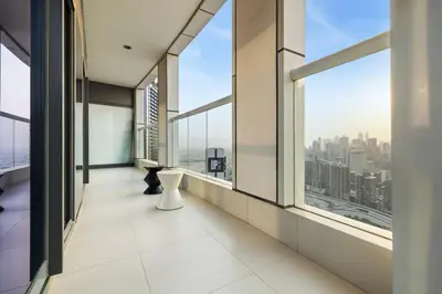an empty room with large windows in a building at BLVD - Damac Paramount with Burj Khalifa View in Dubai