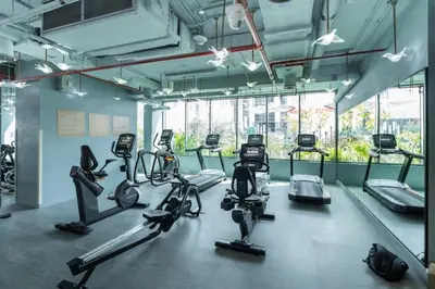 a gym with cardio bikes and tread machines at Vogue Downtown Mag 318 near Burj Khalifa and Dubai Mall, Studio Apartment with Balcony, Canal and City Skyline View, Access to all Amenities in Dubai