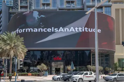 a large sign on the side of a building at Iconic Address 1BR Above Dubai Mall by Maxx value homes in Dubai