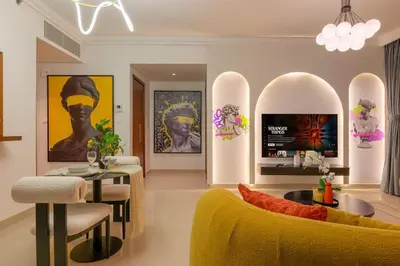 a living room with a couch and a table at Iconic Address 1BR Above Dubai Mall by Maxx value homes in Dubai