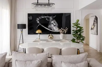 a dining room with a table and a picture of a horse at Beautiful 2 bed in JBR SHAMS in Dubai