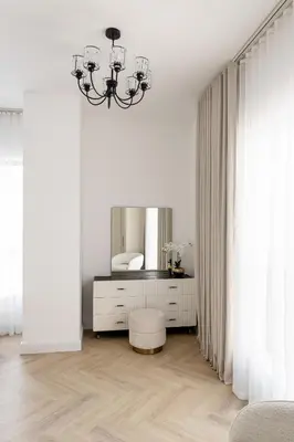 a white bedroom with a mirror and a dressing table at Beautiful 2 bed in JBR SHAMS in Dubai