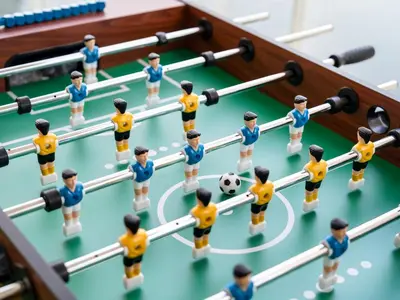a group of miniature people playing a game of soccer at Stunning Burj Khalifa & Lake View 2BR with GYM and Pool in Dubai