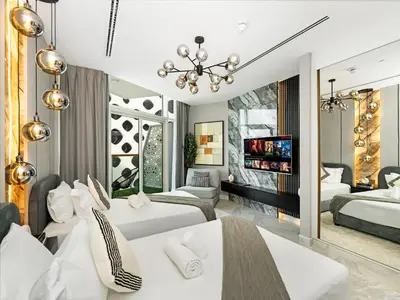 a bedroom with two beds and a large mirror at Stunning Burj Khalifa & Lake View 2BR with GYM and Pool in Dubai