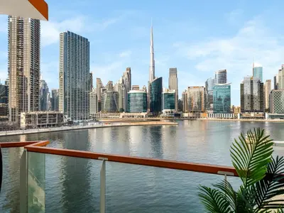 a view of a city skyline with a body of water at Stunning Burj Khalifa & Lake View 2BR with GYM and Pool in Dubai