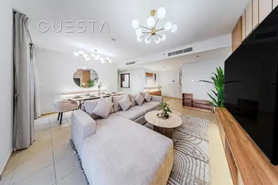 a living room with a couch and a table at Jumeirah Beach Residence - Murjan 5, Dubai Marina in Dubai