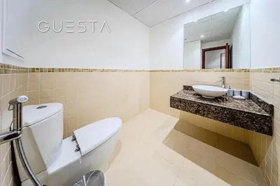 a bathroom with a toilet and a sink at Jumeirah Beach Residence - Murjan 5, Dubai Marina in Dubai