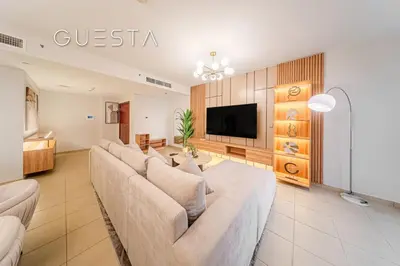 a living room with a couch and a flat screen tv at Jumeirah Beach Residence - Murjan 5, Dubai Marina in Dubai