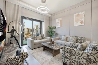 a living room with a couch and a table at Luxury 1BHK Burj Khalifa & Canal View in Dubai