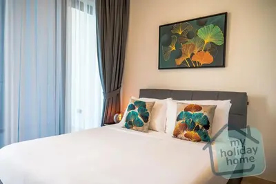 a bedroom with a large white bed with pillows at Burj Khalifa View-Beautiful Pool-Gym-Business Bay in Dubai