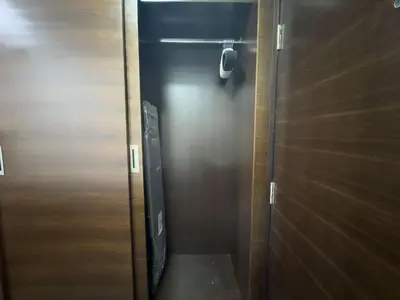 a elevator with a wooden door in a room at Studio Apartment in Sparkle Tower Dubai Marina in Dubai