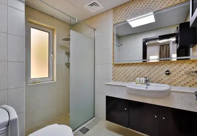 a bathroom with a sink and a mirror at 5BR & Maids Room with Private Pool in The Aldea, The Villa - Allsopp & Allsopp in Dubai