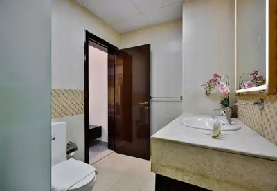 a bathroom with a sink and a toilet in it at 5BR & Maids Room with Private Pool in The Aldea, The Villa - Allsopp & Allsopp in Dubai