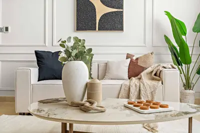 a living room with a coffee table and a couch at Silkhaus Comfy 1BDR at Sky Gardens in DIFC-NEW in Dubai