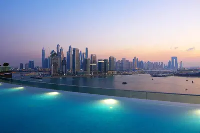 a view of a city skyline with a large body of water at Spacious 1 bed with seaview in Seven Palm - Palm Jumeirah - IQPRO Holidays in Dubai