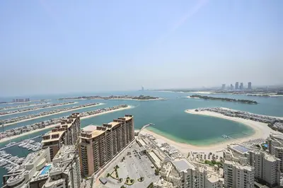 an aerial view of a city with a beach and buildings at NEW Luxury studio - Amazing Palm Views in Dubai