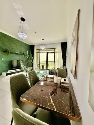 a living room with a glass table and chairs at Spacious Luxury Lagoon View 2Bhk in Dubai