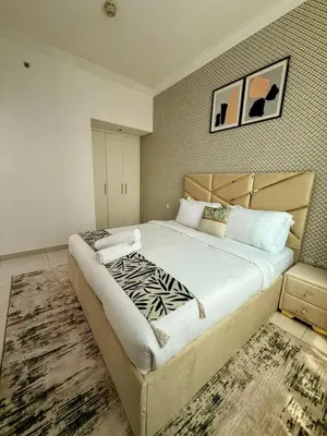 a bedroom with a large bed in a room at Spacious Luxury Lagoon View 2Bhk in Dubai