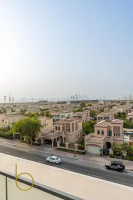 a view of a city street with houses and cars at Bookable - Studio Room, Bali Residences JVT in Dubai