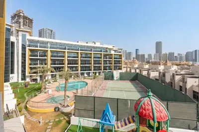 a view of a building with a water park at Walking Distance to Circle Mall and Community Parks, 18 Minute Drive to Dubai Marina and JBR Beach, Crystal Residence, JVC by Deluxe Holiday Homes in Dubai