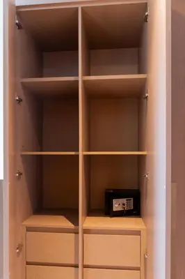 a closet with a book shelf with a toaster on it at Stunning 2 bed dubai mall burj khalifa downtown ACT 1 in Dubai