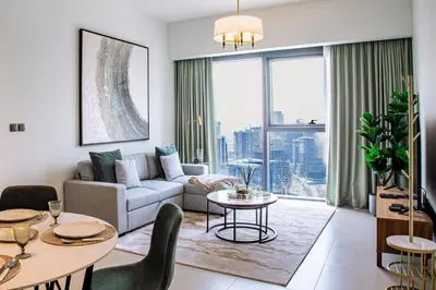 a living room with a couch and a table at Stunning 2 bed dubai mall burj khalifa downtown ACT 1 in Dubai