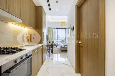 a kitchen with a sink and a stove at Bloomfields Supreme Stu In Azizi Riviera in Dubai