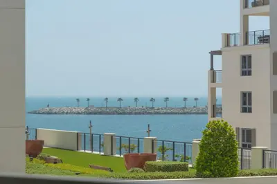 a view of the ocean from a building at Port de la Mer Luxury Sleeps 4Person in Dubai
