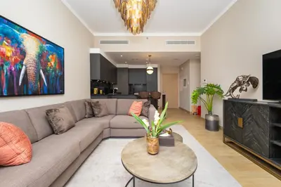 a living room with a couch and a table at Port de la Mer Luxury Sleeps 4Person in Dubai