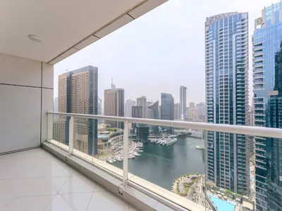a balcony with a view of a river in a city at Continental Tower Luxury 2BR Dubai Marina Views in Dubai
