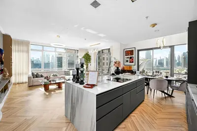 a kitchen and living room with views of the city at Stunning 2 Bdr Luxury Burj Khalifa view in Dubai