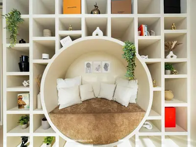 a room with a large white shelf with pillows at Dubai Hills Mansion Cinema, Gym & Luxe Pool in Dubai