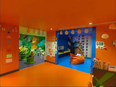 an orange room with a toy room with a play area at Luxury Studio with Pool, Gym & Downtown Access in Dubai