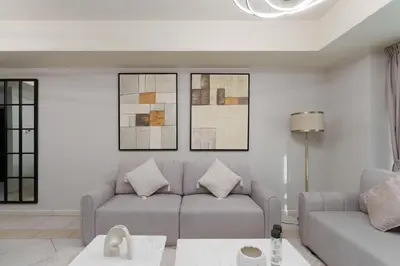 a living room with a couch and a table at Large Flat in High Floor with view to Marina Canal & Beach sleep 8px in Dubai