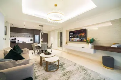 a living room with a couch and a table at SettlerHomes - 14F Ocean View Gem With Private Beach in Dubai