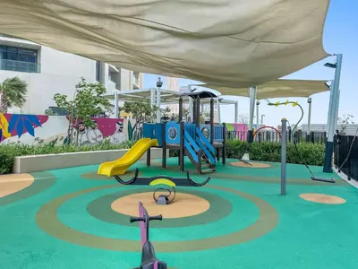 a playground with a slide and a play structure at Silkhaus Studio Escape in Business Bay in Dubai