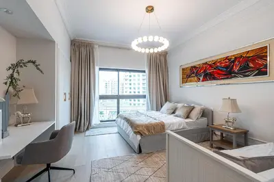 a bedroom with a bed and a large window at Spacious 2 bedroom apartment I Palm Jumeirah in Dubai