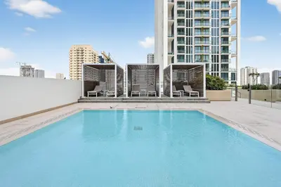 a swimming pool on the roof of a building at Golden Stays - Private Pool in Binghatti Gardenia I Modern 2BR Escape in Dubai