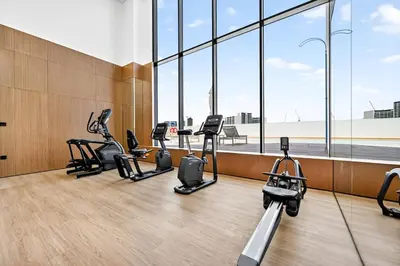 a gym with a row of exercise bikes in a building at Golden Stays - Private Pool in Binghatti Gardenia I Modern 2BR Escape in Dubai